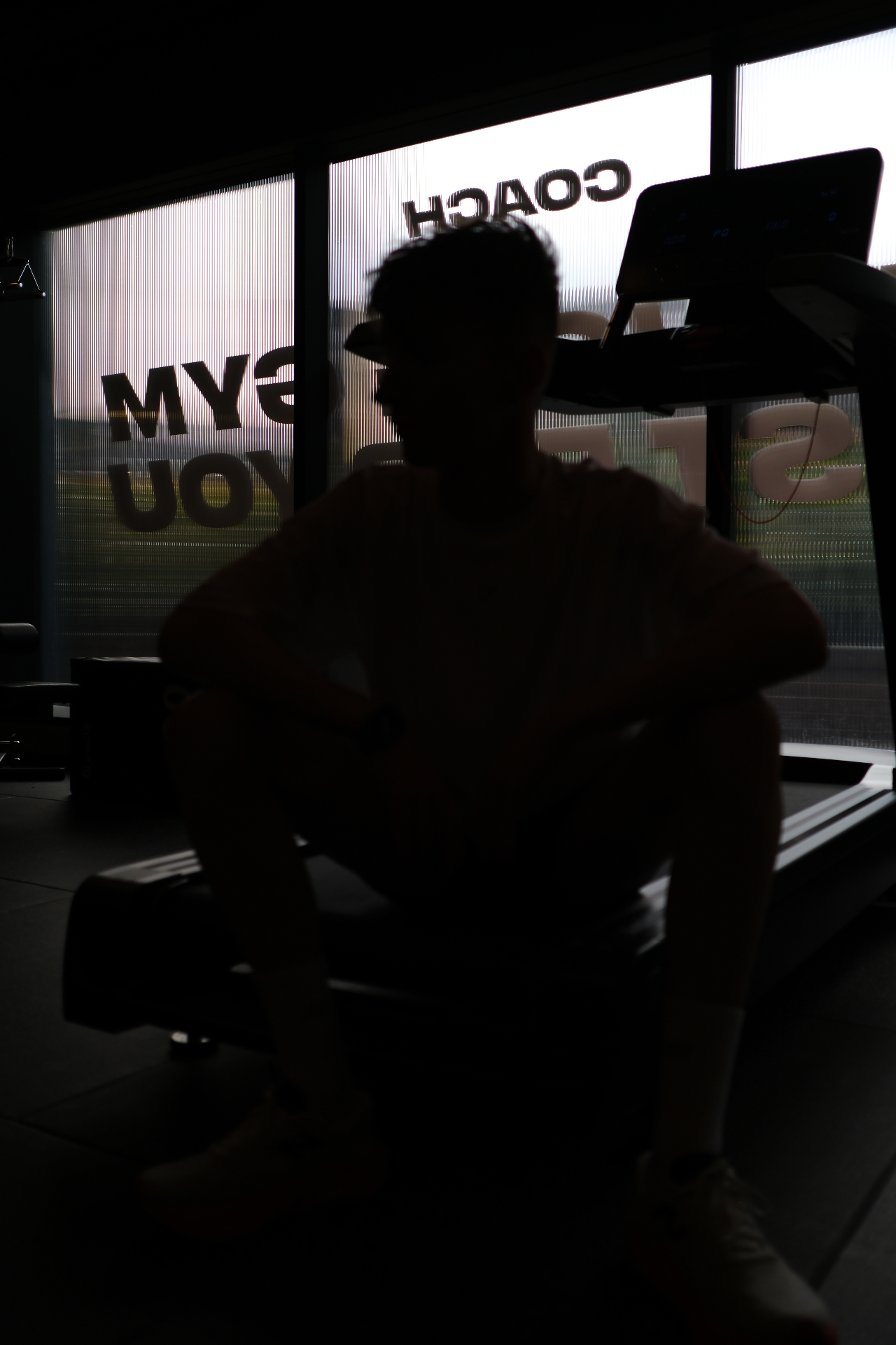 Silhouette against the gym window
